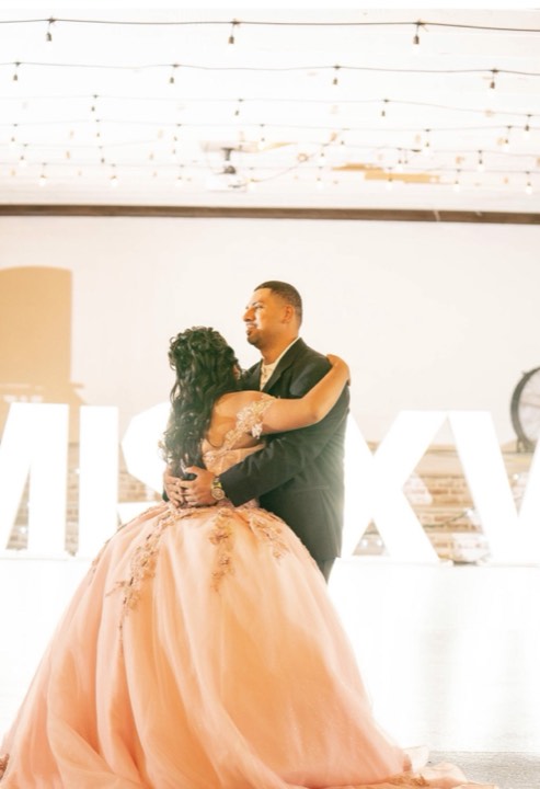 First dance under string lights at our Orem, Utah wedding and quinceañera venue