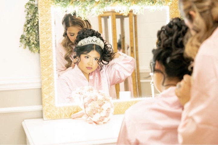 Getting ready, mirror moment at our Orem, Utah wedding and quinceañera venue