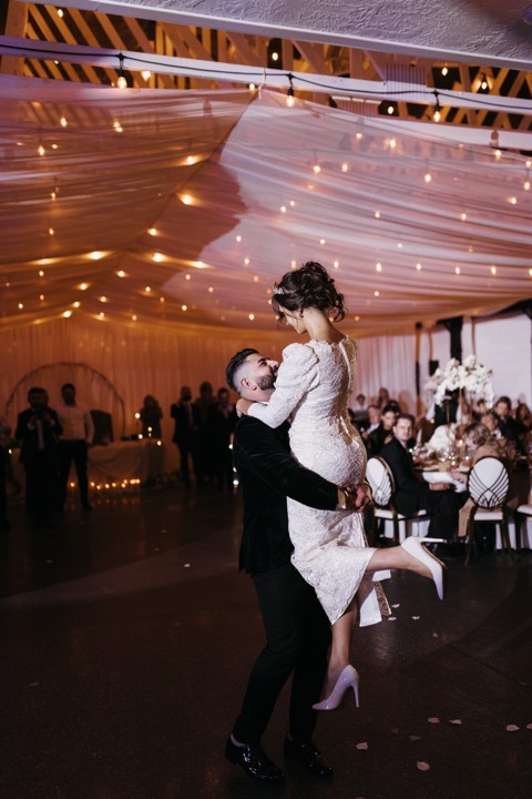 Groom lifting bride, first dance at our Orem, Utah wedding and quinceañera venue